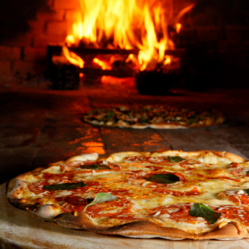 A delicious pizza placed on a table, ready to be devoured.